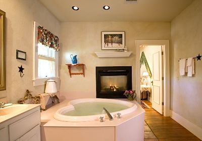 private en suite bathroom with fireplace