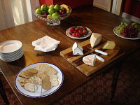 crackers cheese and fruit on table