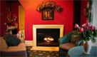 soft chairs before fireplace