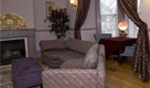 couch by fireplace