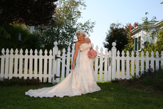 Bride by picket fence