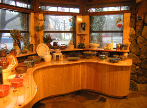 curved wooden counter with dishes