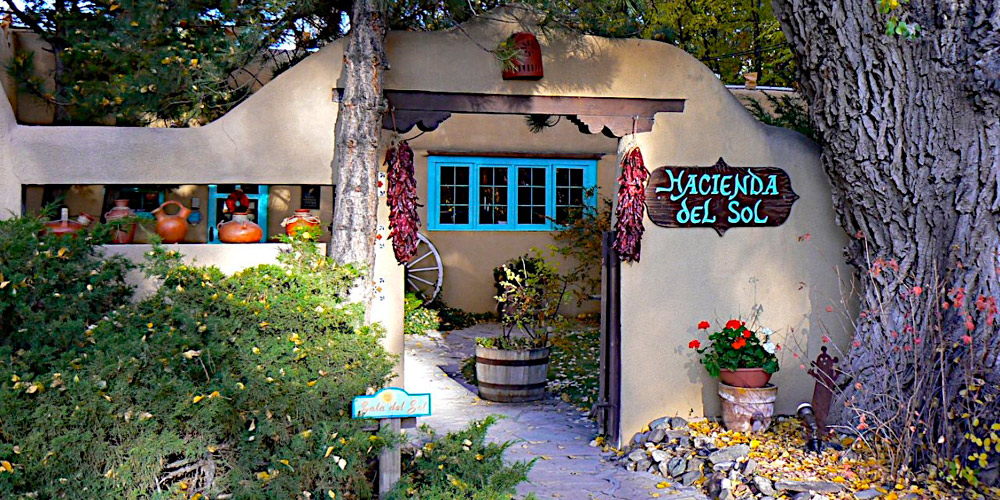 Front Gate of Hacienda del Sol, dates back to 1804 featuring Chili Ristras and New Mexican Clay pots