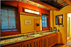 Adobe bathroom with wonderful Mexican tiled sink and steam shower.