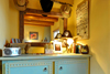 Cowboy room includes a CD player, mini fridge, wine glasses and ice bucket.