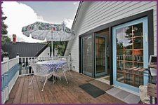 Couer d'alene Suite deck patio with table and umbrella