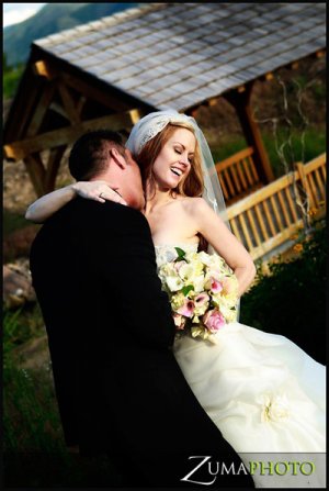 groom kissing bride's neck