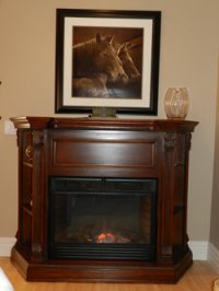 fire place with picture of horses above it at Stone Gate Inn B&B