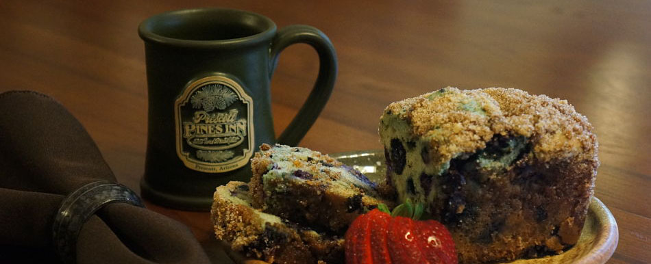Prescott Pines Inn mugs and breakfast blueberry bread with strawberries