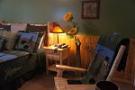 Sunflowers and Rocking Chair by Bed
