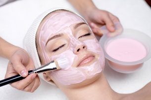 woman receiving facial