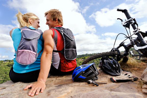 couple mountain biking