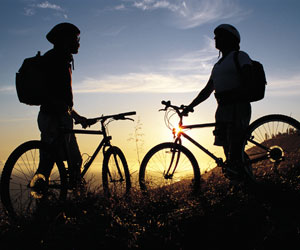 mountain biking at sunset