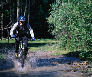 mountain biking in a river