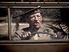 old-fashioned man in a car