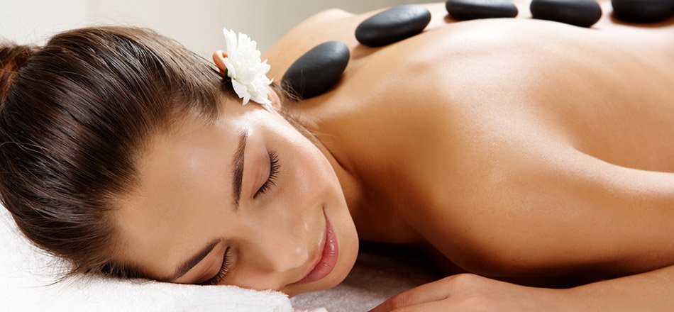 woman with hot stones on her back