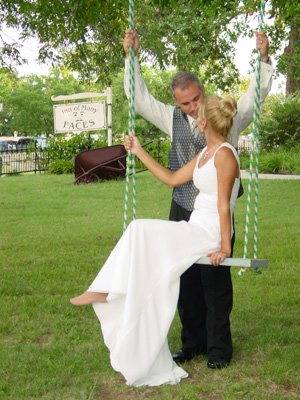 Wedding Couple kissing on Swing