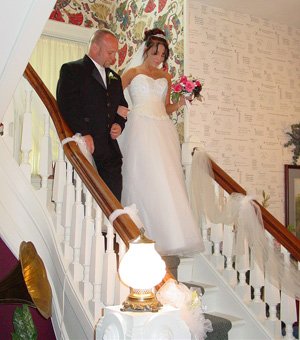 Bride and Father walking down indoor steps