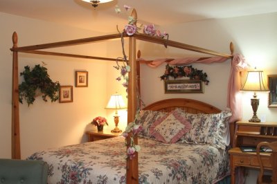 Canopy bed with flowers at Willows Inn