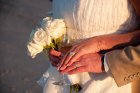 Couple with wedding roses and champagne
