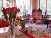 flowers and sitting area in sunroom