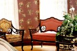 couch with coffee table and flowers
