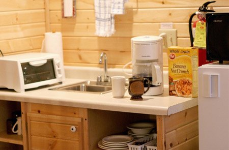 Kitchen with appliances and ingredients.