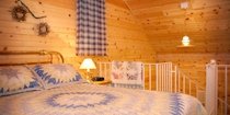 bed at the top of the stairs