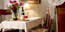 dining table set with floral centerpiece