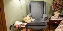 arm chair next to bed