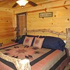 bed in Crazy Horse Cabin at Hochatown Junction in Broken Bow, OK