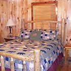 bed in Front Porch Lodge at Hochatown Junction in Broken Bow, OK