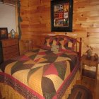 bed in Bear Necessities Cabin at Hochatown Junction in Broken Bow, OK